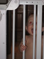 Mary behind the gate at the top of the stairs she is naked and screaming out.