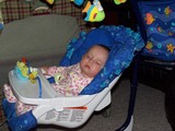 Mary asleep in her swing.