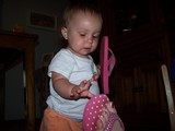Mary taking off one of Mommy's flip-flops.