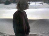 Sherri (aka. mommy) in front of a 3 foot snow drift that was against our garage door.