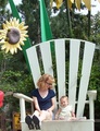 Mommy and Mary sitting in an over-sized chair.
