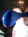 A closeup of Mary's spoon all but covering her face as she holds it out to the camera.