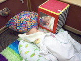 Mary swaddled and asleep at daycare.