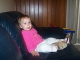 Mary leaning back on the couch wearing her monkey slippers.